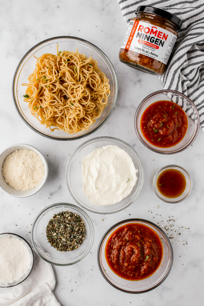 ingredients for ramen lasagna including instant noodles and cheese
